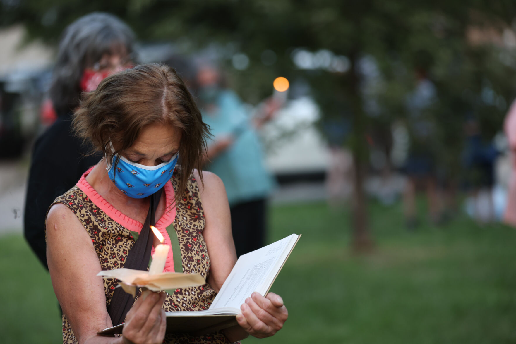 Community Member Holding Book